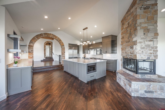 182 Juniper Rd S, Ridgway, CO 81432 - kitchen featuring gray cabinets, open shelves, built in appliances, light countertops, and vaulted ceiling