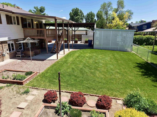 2020 Essex St, Montrose, CO 81401 - view of yard featuring a patio area and a vegetable garden