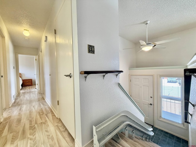 2020 Essex St, Montrose, CO 81401 - entrance foyer with a textured ceiling, a ceiling fan, light wood finished floors, and baseboards