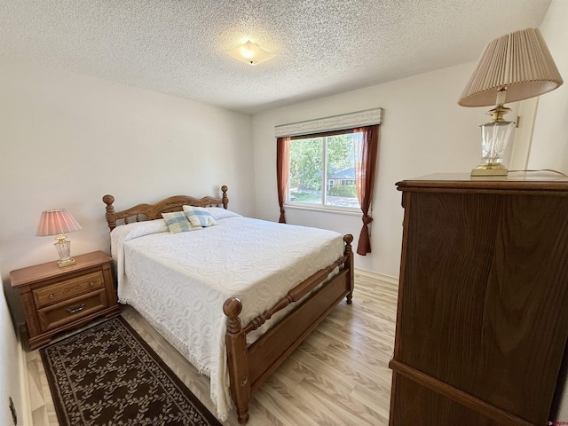 2020 Essex St, Montrose, CO 81401 - bedroom featuring light wood finished floors and a textured ceiling