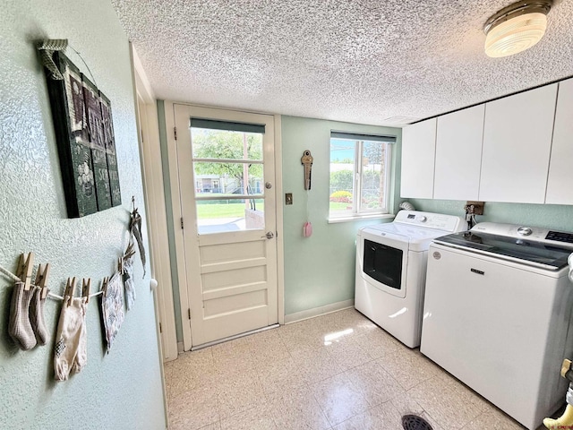 2020 Essex St, Montrose, CO 81401 - laundry room with cabinet space, washer and dryer, baseboards, plenty of natural light, and a textured ceiling