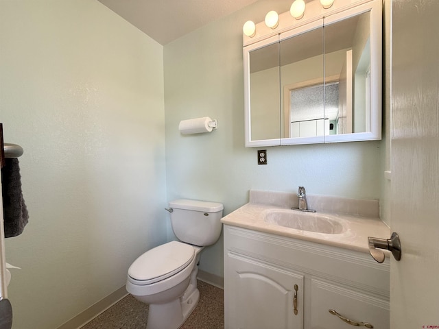 2020 Essex St, Montrose, CO 81401 - bathroom with baseboards, vanity, and toilet