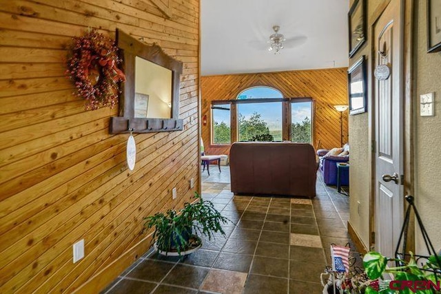 538 Rugby Mines Rd, Walsenburg, CO 81089 - hall featuring wooden walls, healthy amount of natural light, and stone finish flooring
