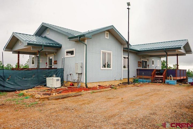 538 Rugby Mines Rd, Walsenburg, CO 81089 - rear view of house with metal roof and a wooden deck