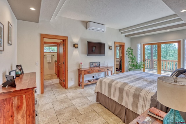 520B Whispering Wood Dr, Pagosa Springs, CO 81147 - bedroom featuring a wall mounted AC, a textured ceiling, stone tile floors, recessed lighting, and ensuite bathroom