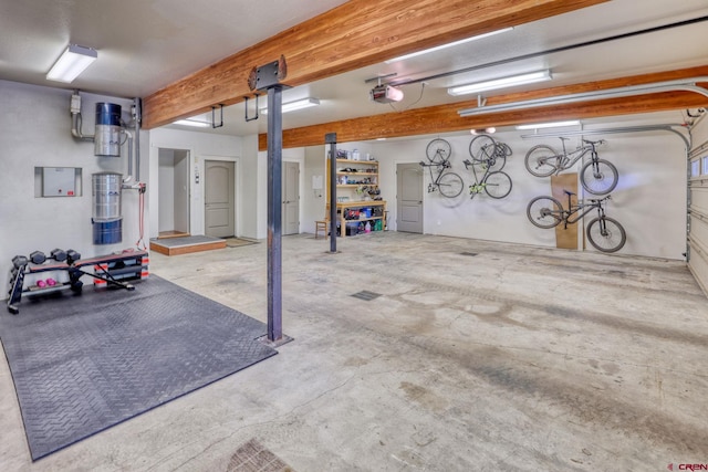 520B Whispering Wood Dr, Pagosa Springs, CO 81147 - garage featuring a garage door opener, a central vacuum unit, and electric panel