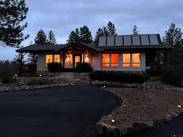 520B Whispering Wood Dr, Pagosa Springs, CO 81147 - view of front of house with stucco siding and a porch