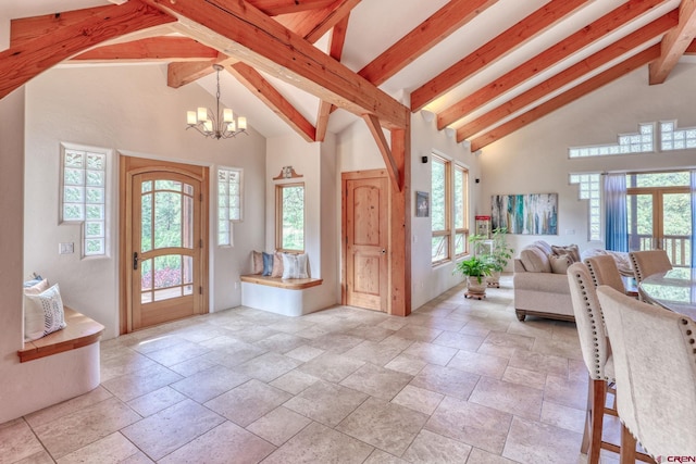 520B Whispering Wood Dr, Pagosa Springs, CO 81147 - foyer with a chandelier, stone tile flooring, healthy amount of natural light, beamed ceiling, and high vaulted ceiling