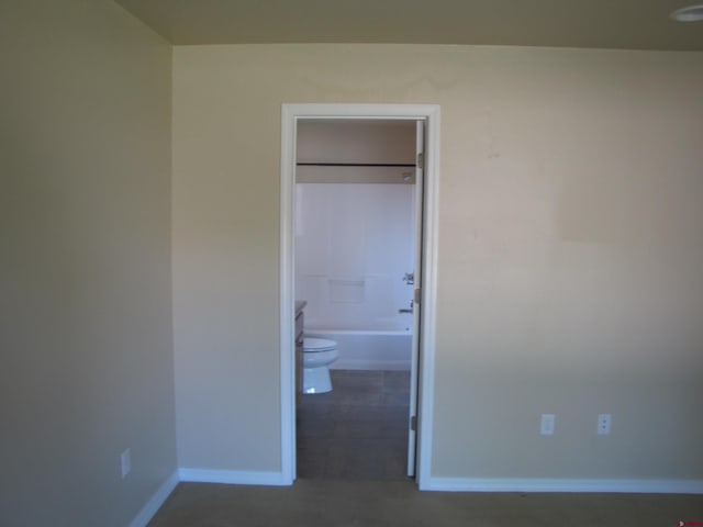 1756 Freedom Way, Montrose, CO 81401 - unfurnished bedroom featuring baseboards and ensuite bath