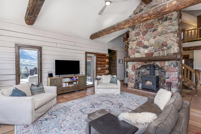 156 Zeligman St, Crested Butte, CO 81224 - living room with a wood stove, tile patterned flooring, and wooden walls