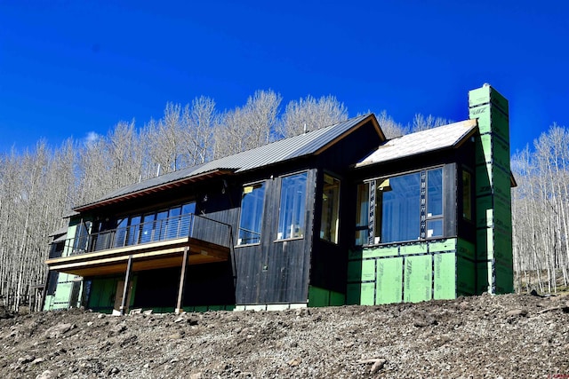 1620 Red Mountain Ranch Rd, Crested Butte, CO 81225 - rear view of property featuring metal roof and a chimney