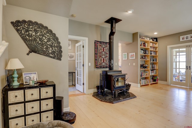 15307 Rd R, Cahone, CO 81320 - living area with a wood stove, french doors, wood-type flooring, recessed lighting, and baseboards