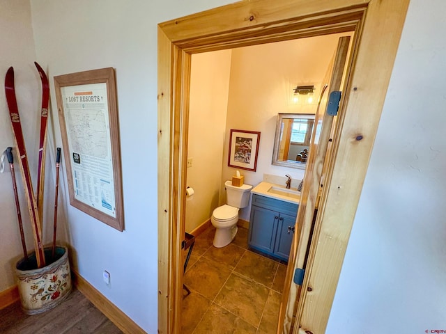 405 Meridian Lake Dr, Crested Butte, CO 81224 - bathroom featuring vanity, toilet, baseboards, and tile patterned floors