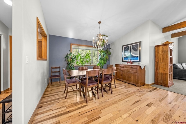 125 Ball Ln, Durango, CO 81301 - dining area with light wood-style floors, lofted ceiling, a chandelier, and baseboards