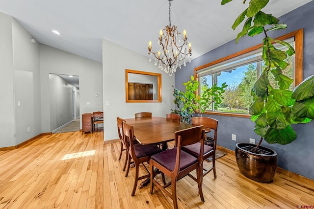 125 Ball Ln, Durango, CO 81301 - dining space with vaulted ceiling, light wood-style floors, baseboards, and a chandelier