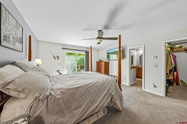 125 Ball Ln, Durango, CO 81301 - bedroom featuring a spacious closet, carpet floors, ensuite bathroom, ceiling fan, and baseboards