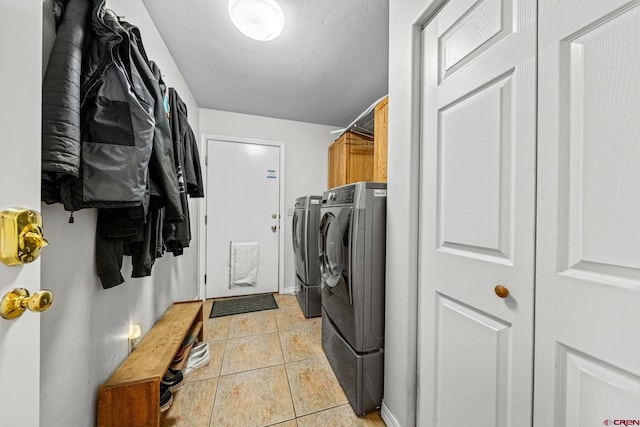 125 Ball Ln, Durango, CO 81301 - laundry room with washer and clothes dryer, cabinet space, and light tile patterned floors
