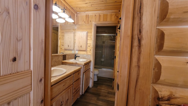33 Fawn Ct, Pagosa Springs, CO 81147 - full bath with vanity, toilet, bath / shower combo with glass door, wood finished floors, and wood ceiling