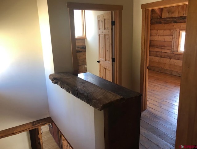 451 9th St, Crested Butte, CO 81224 - bar area featuring hardwood / wood-style floors, plenty of natural light, and wood walls