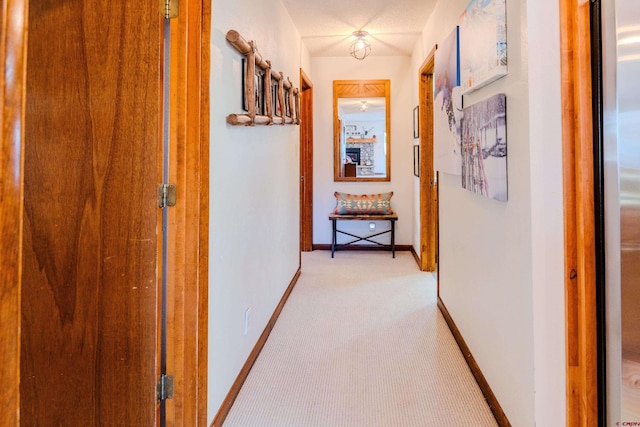 35 Emmons Rd Unit 11, Mount Crested Butte, CO 81225 - hallway with light colored carpet and baseboards