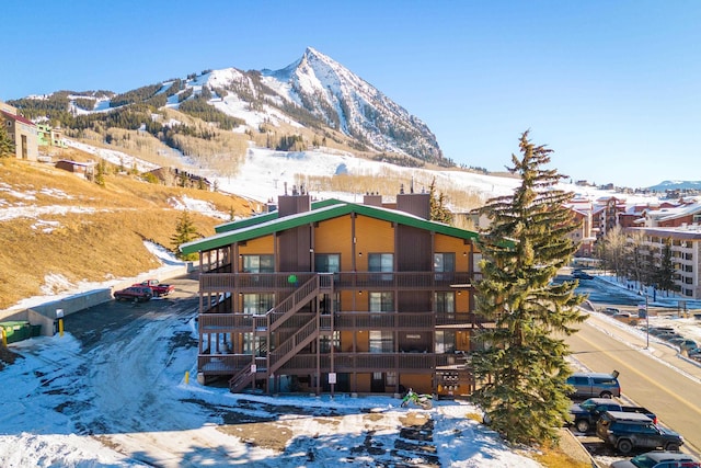 35 Emmons Rd Unit 11, Mount Crested Butte, CO 81225 - snow covered building featuring a mountain view