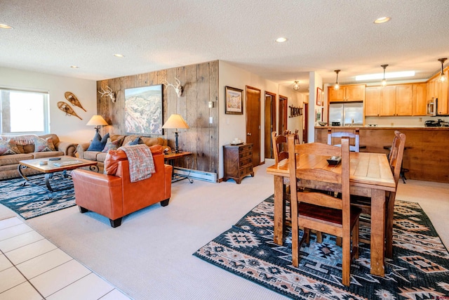 35 Emmons Rd Unit 11, Mount Crested Butte, CO 81225 - dining area featuring a textured ceiling, light colored carpet, wood walls, and recessed lighting