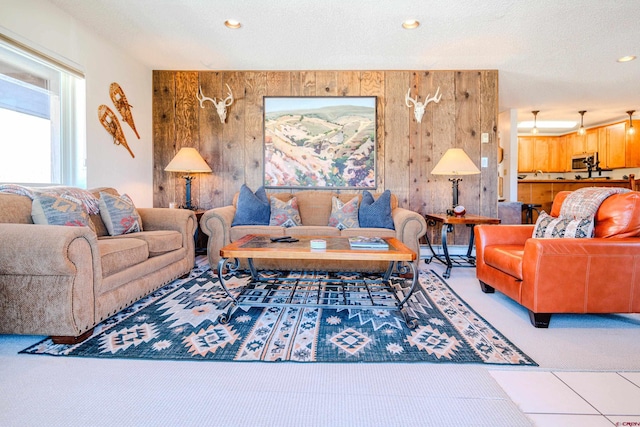 35 Emmons Rd Unit 11, Mount Crested Butte, CO 81225 - living area featuring light colored carpet, recessed lighting, and wood walls