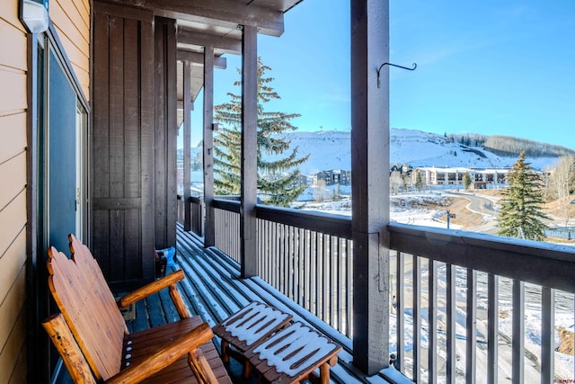 35 Emmons Rd Unit 11, Mount Crested Butte, CO 81225 - snow covered back of property with a mountain view