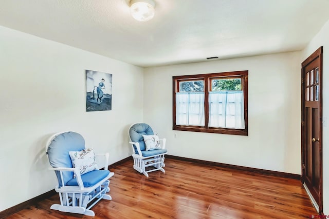 175 NW 4th St, Cedaredge, CO 81413 - sitting room featuring wood finished floors and baseboards