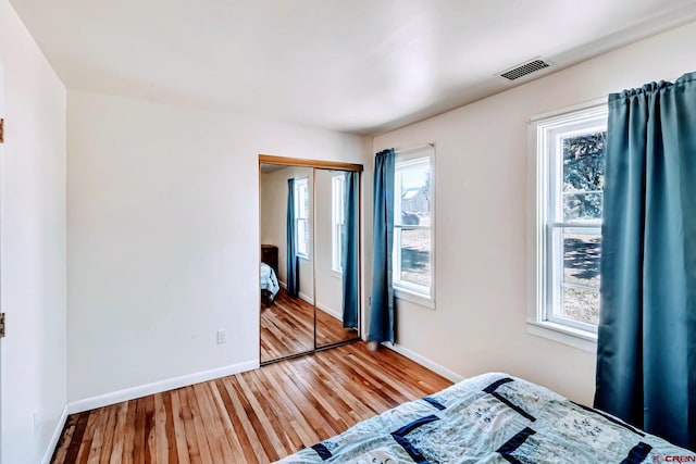 175 NW 4th St, Cedaredge, CO 81413 - bedroom with wood finished floors, baseboards, and a closet