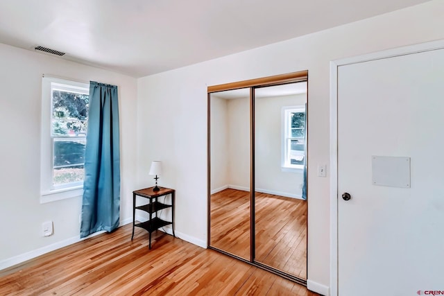 175 NW 4th St, Cedaredge, CO 81413 - unfurnished bedroom featuring light wood finished floors, a closet, and baseboards