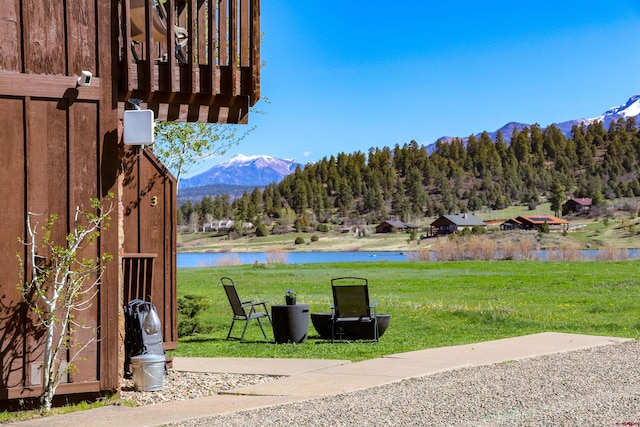 190 Luxury Pl Unit 3, Pagosa Springs, CO 81147 - view of grassy yard with a water and mountain view and a wooded view