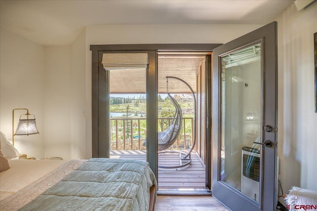 190 Luxury Pl Unit 3, Pagosa Springs, CO 81147 - bedroom featuring wood finished floors and access to exterior