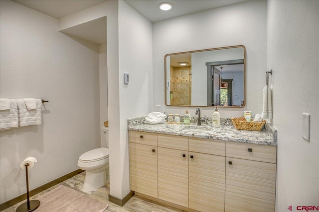 190 Luxury Pl Unit 3, Pagosa Springs, CO 81147 - bathroom with wood finished floors, vanity, toilet, and baseboards