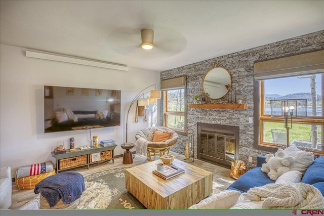 190 Luxury Pl Unit 3, Pagosa Springs, CO 81147 - living room featuring a ceiling fan and a fireplace