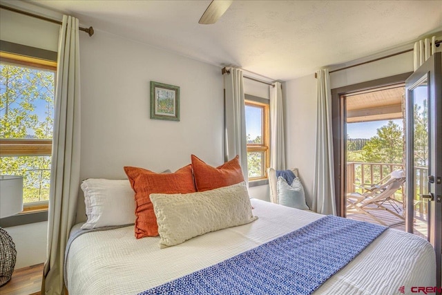 190 Luxury Pl Unit 3, Pagosa Springs, CO 81147 - bedroom featuring access to outside, multiple windows, and a ceiling fan