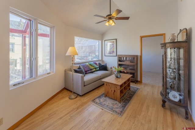 310 Second St, Crested Butte, CO 81224 - living area featuring vaulted ceiling, light wood-type flooring, plenty of natural light, a ceiling fan, and baseboards
