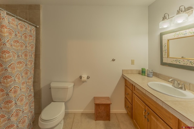 310 Second St, Crested Butte, CO 81224 - bathroom with vanity, toilet, a shower with curtain, tile patterned flooring, and baseboards
