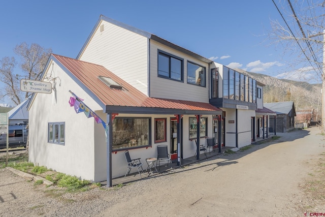 310 Second St, Crested Butte, CO 81224 - view of front of house featuring a porch and metal roof