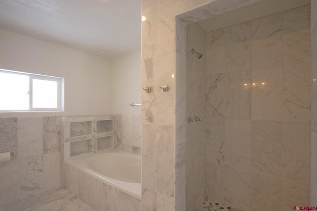 511 E Garland St, La Veta, CO 81055 - full bath with a garden tub, a marble finish shower, and tile walls