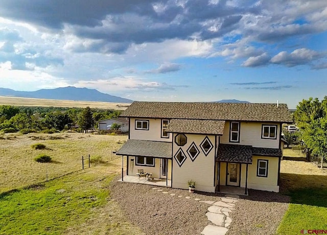 511 E Garland St, La Veta, CO 81055 - view of front of house featuring a mountain view and a shingled roof