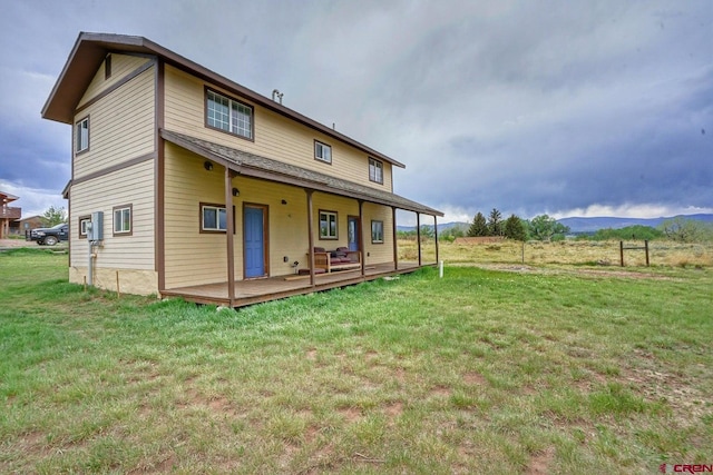 511 E Garland St, La Veta, CO 81055 - back of property featuring a yard and a mountain view