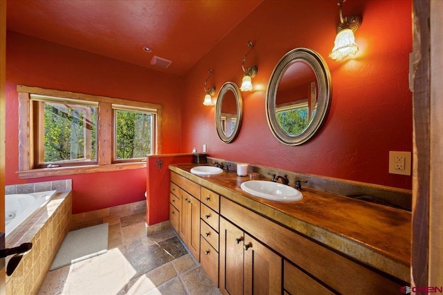 178 Valley View Rd, Ridgway, CO 81432 - full bath with double vanity, stone tile floors, and a whirlpool tub
