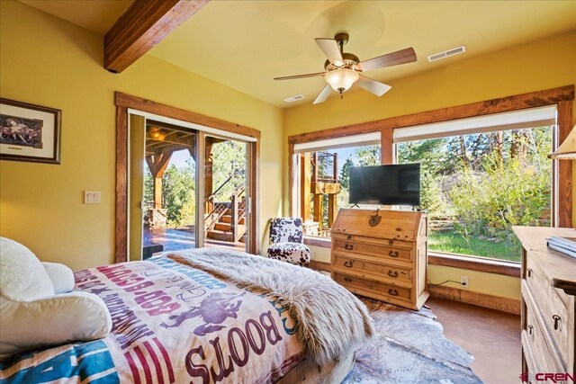178 Valley View Rd, Ridgway, CO 81432 - carpeted bedroom with access to exterior, multiple windows, beam ceiling, and a ceiling fan