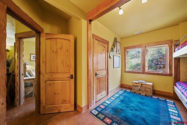 178 Valley View Rd, Ridgway, CO 81432 - bedroom with baseboards and concrete flooring