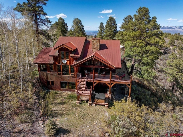 178 Valley View Rd, Ridgway, CO 81432 - back of house with a wooden deck, a chimney, stairs, metal roof, and a forest view