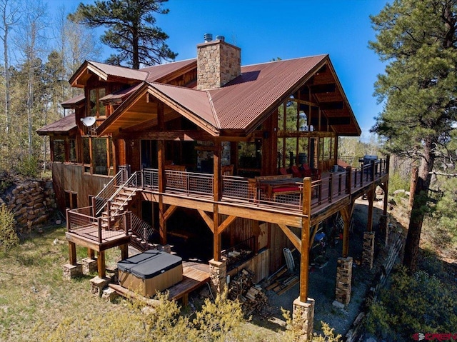 178 Valley View Rd, Ridgway, CO 81432 - rear view of property with a chimney, a wooden deck, and metal roof