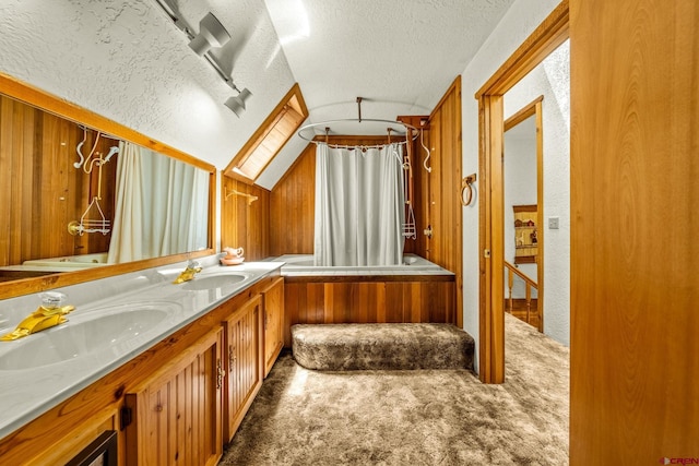 953 Mushroom Ln, Bayfield, CO 81122 - full bath featuring a textured ceiling, double vanity, shower / bath combination with curtain, and lofted ceiling