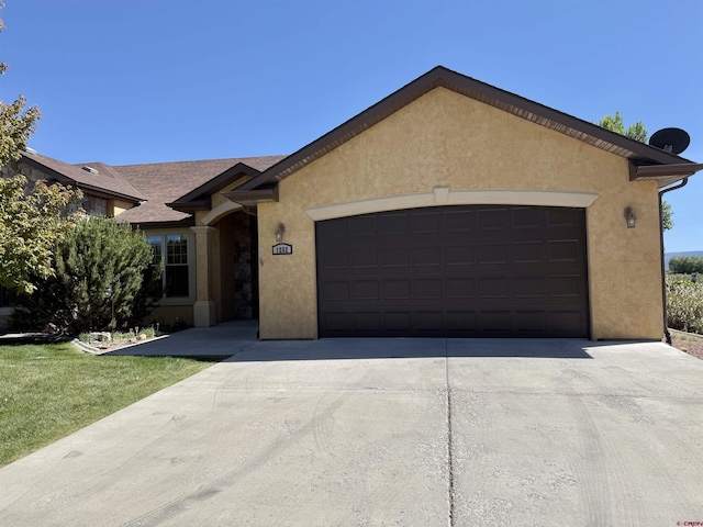 1252 Peppertree Dr, Montrose, CO 81401 - ranch-style house with a garage, concrete driveway, and stucco siding