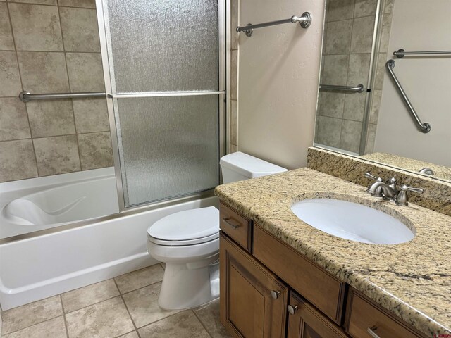 1252 Peppertree Dr, Montrose, CO 81401 - full bath with toilet, vanity, combined bath / shower with glass door, and tile patterned flooring